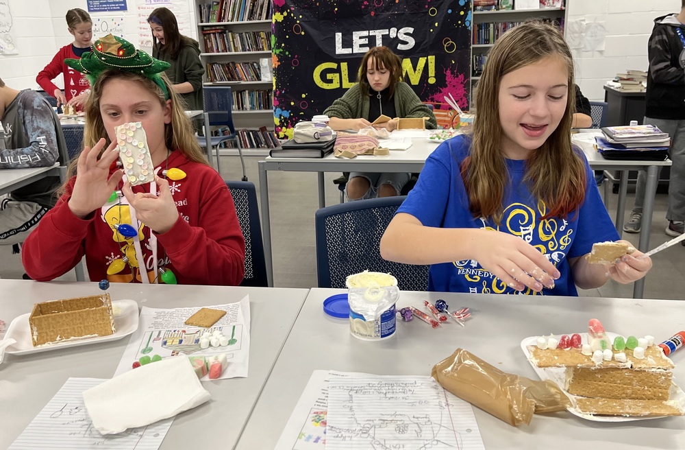 students building gingerbread houses